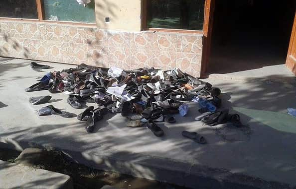 The abandoned shoes of Afghan schoolgirls involved in a deadly stampede are seen outside a school following an earthquake in Takhar Province on October 26, 2015.