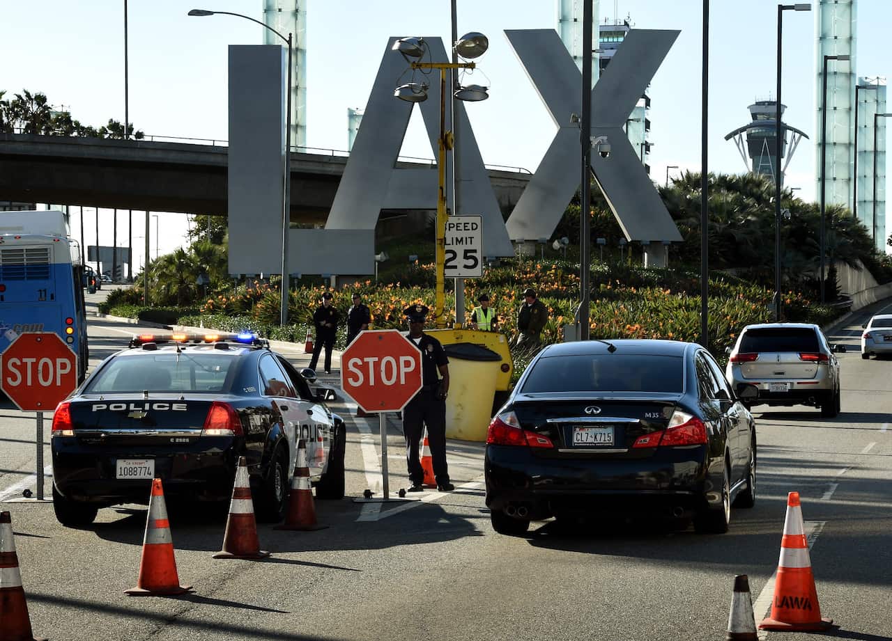 Heavily-armed police kept watch at Los Angeles International Airport (LAX) as security was increased for the Thanksgiving holiday and after threats from ISIS against the United States. 