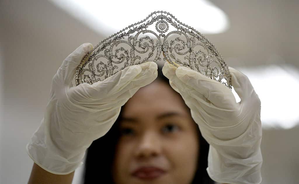 An official from the Presidential Commission on Good Government shows a piece of jewellery seized by the Philippine government from former first lady Imelda Marcos, at the Central Bank headquarters in Manila.