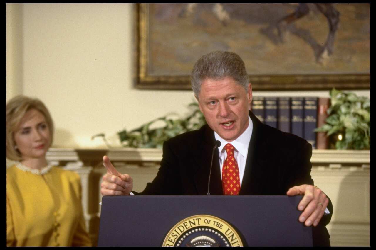 Pres. Bill Clinton wagging finger, emphatically denying having affair w. former White House intern Monica Lewinsky, during White House childcare event w. First Lady Hillary Rodham Clinton at his side.