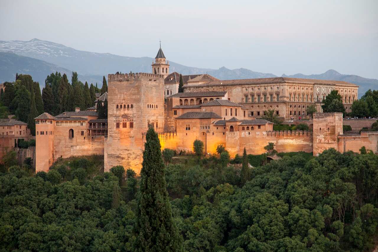 The Arab fortress of Alhambra at sunset. The Alhambra is a palace and fortress complex located in Granada, Andalusia, Spain.