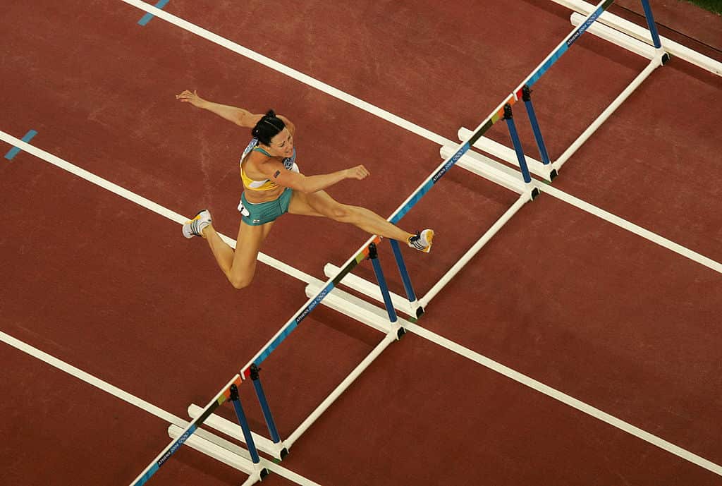 Jana Pittman competes in a 400m hurdles race.