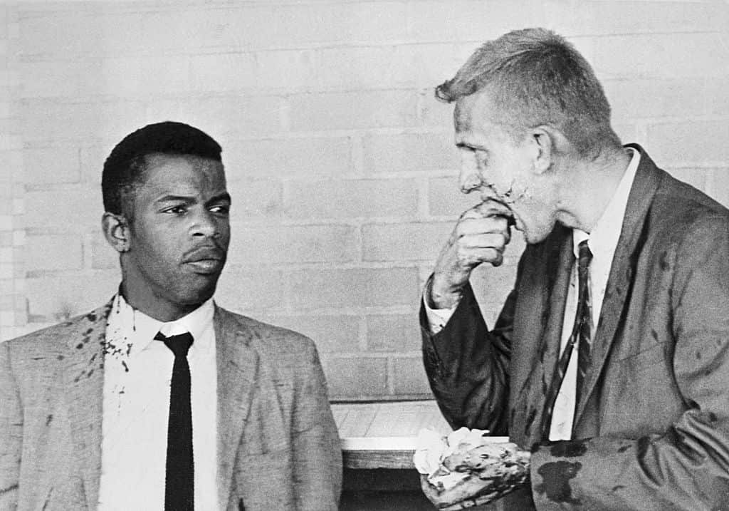 Two Freedom Riders, John Lewis (left) and James Zwerg (right) stand together after being attacked by pro-segregationists in Montgomery, Alabama.