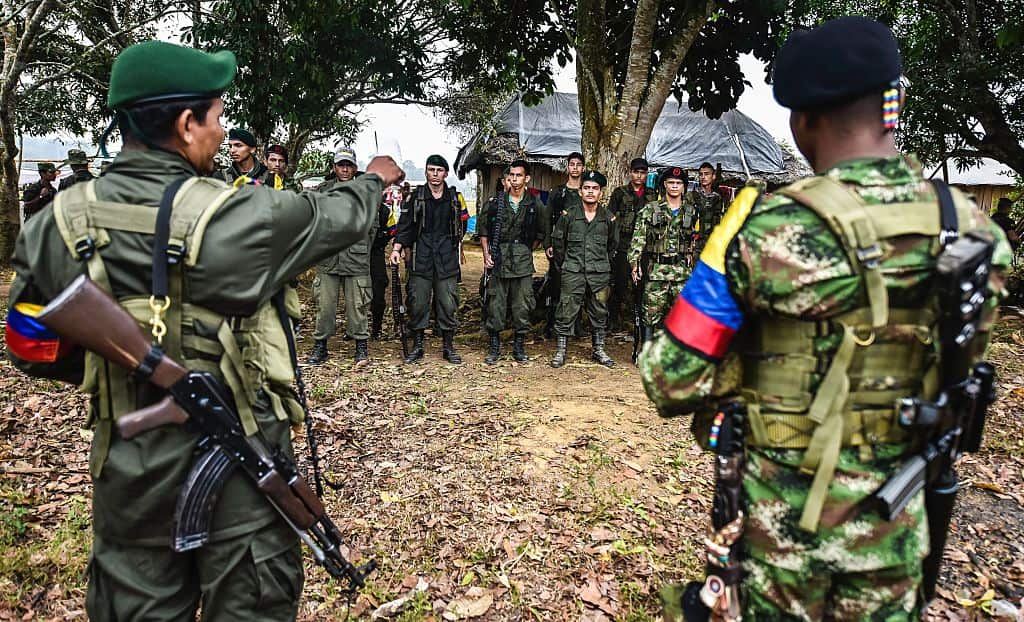 Revolutionary Armed Forces of Colombia (FARC) members stand in formation at a camp in the Magdalena Medio region, Colombia on February 18, 2016.