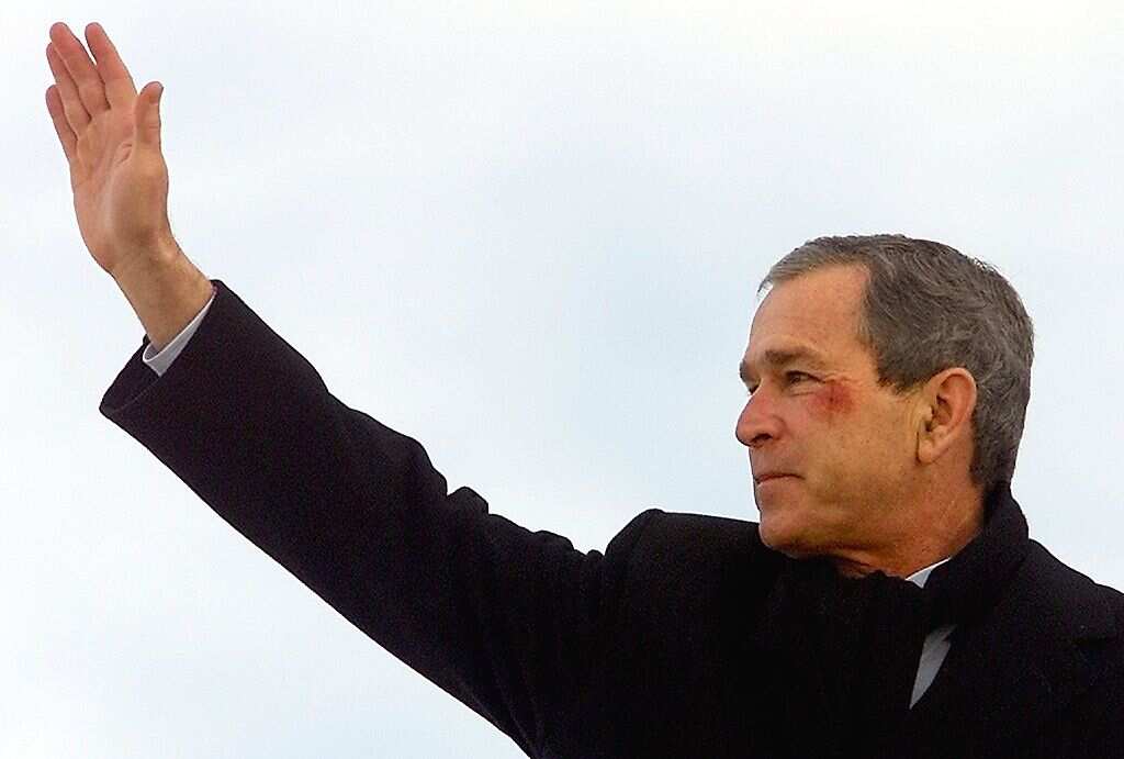 US President George W. Bush waves from the steps o