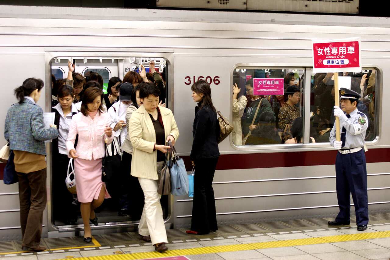 Female passengers come out from "Women Only" carriage at a metro station in Tokyo, Japan.