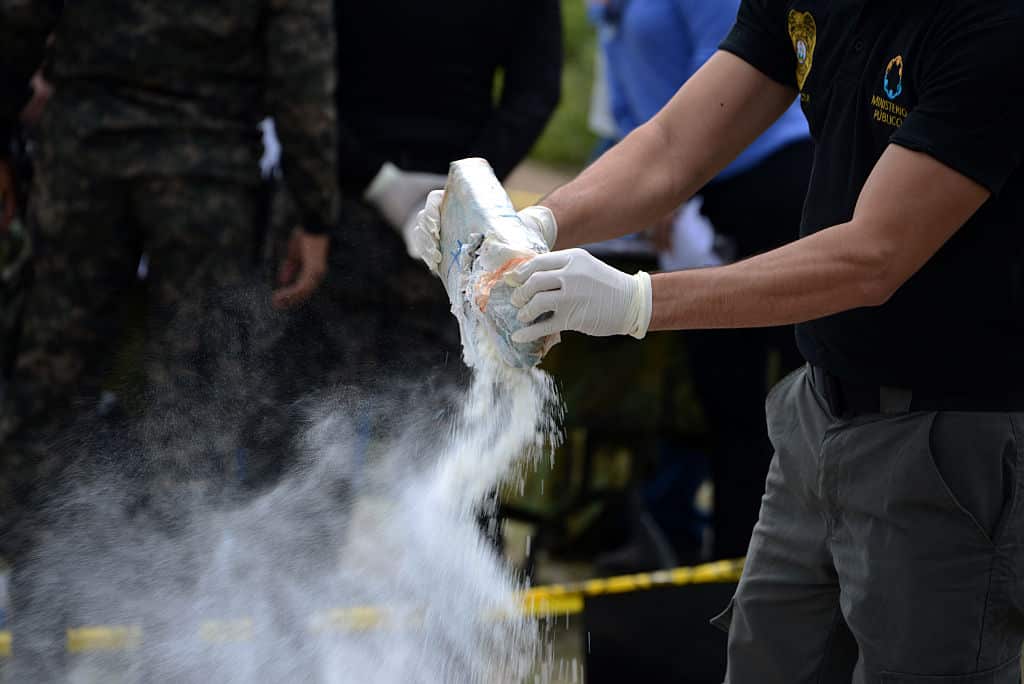 Anti-narcotics and Military Police officers prepare everything for the incineration of more than 200 kilos of cocaine seized in southern Honduras