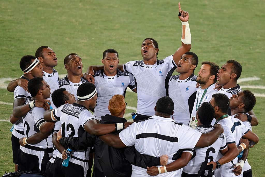 Fiji's players pray after winning the mens rugby sevens gold medal match.