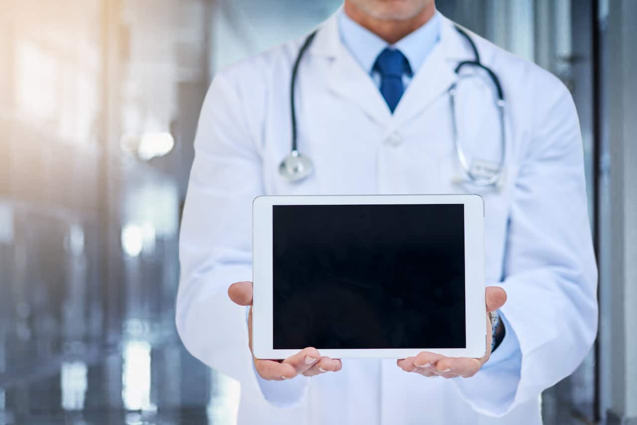 Doctor with screen