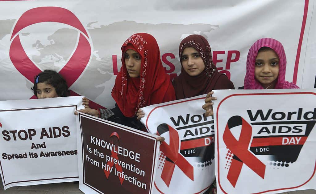 Pakistani social activists carry placards during a rally to raise awareness on World AIDS Day in 2016.