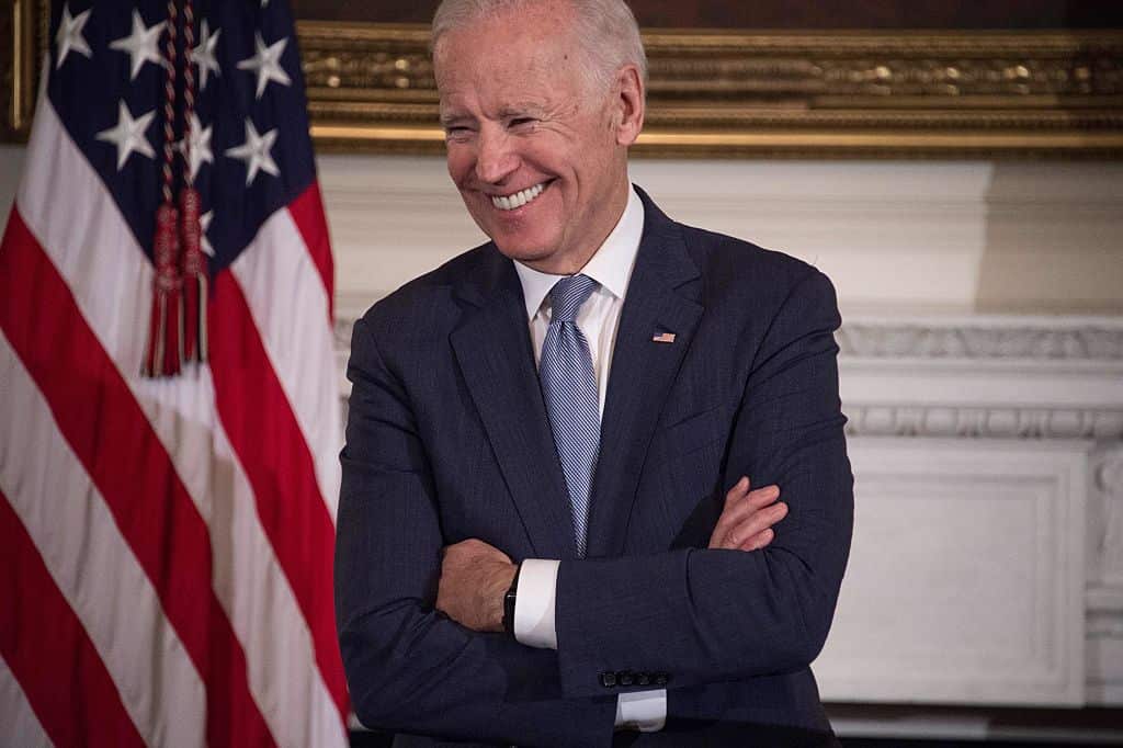 US Vice President Joe Biden laughs as President Barack Obama speaks.