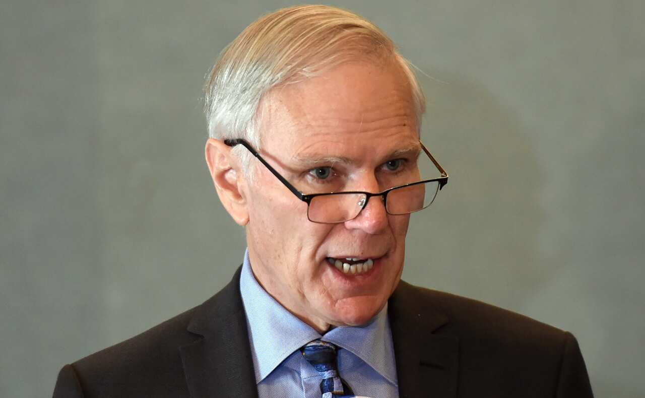 Philip Alston talks at a press briefing.