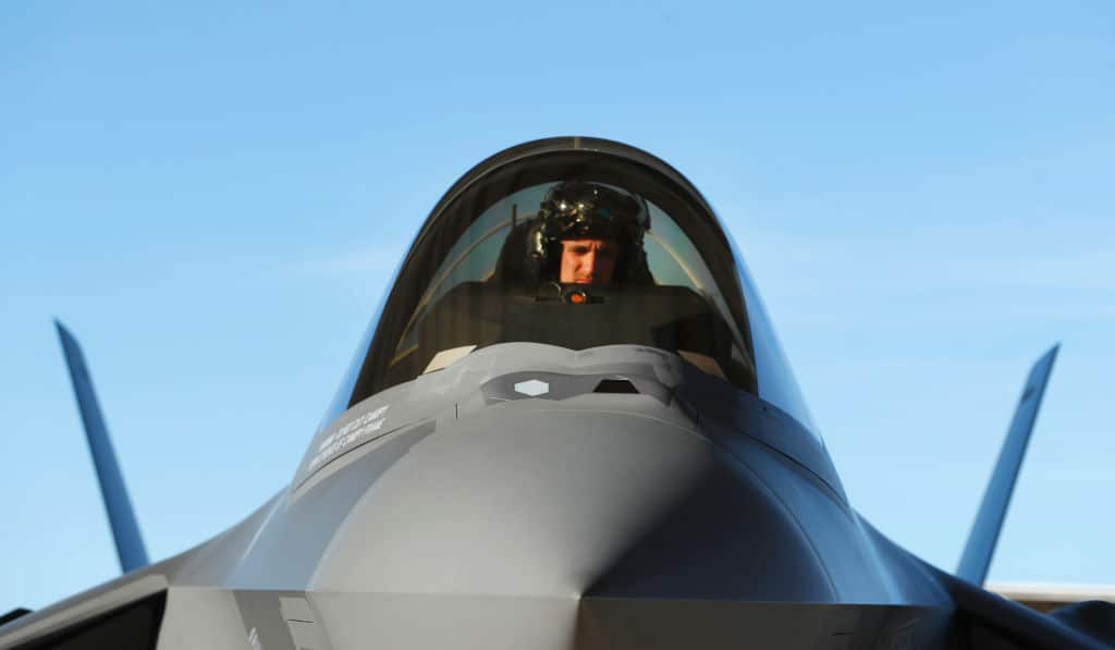 A pilot sits in the cockpit of an F-35 fighter jet preparing for a training mission at Hill Air Force Base in Ogden, Utah. 