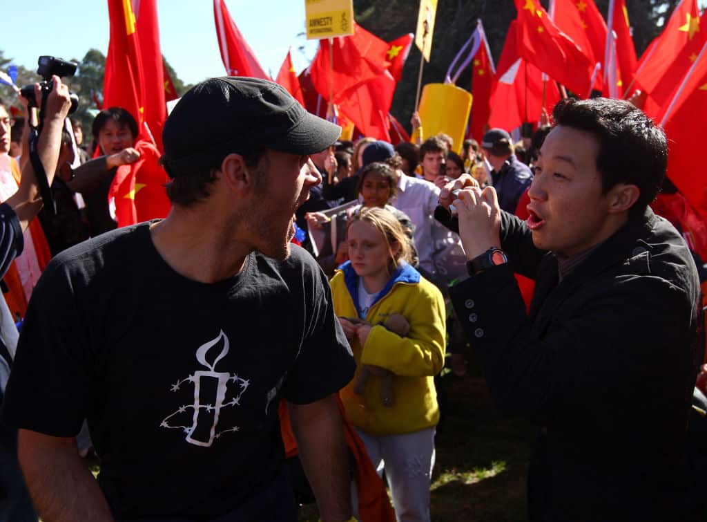 An Amnesty International supporter and Pro-China supporter clash during the Beijing 2008 Olympic Torch Relay.
