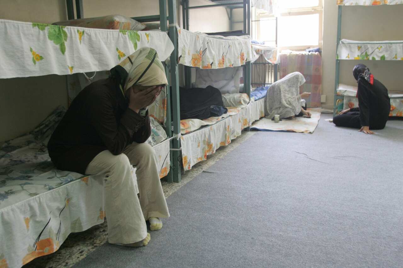 Iranian women inmates sit at their cell in the infamous Evin jail, north of Tehran.