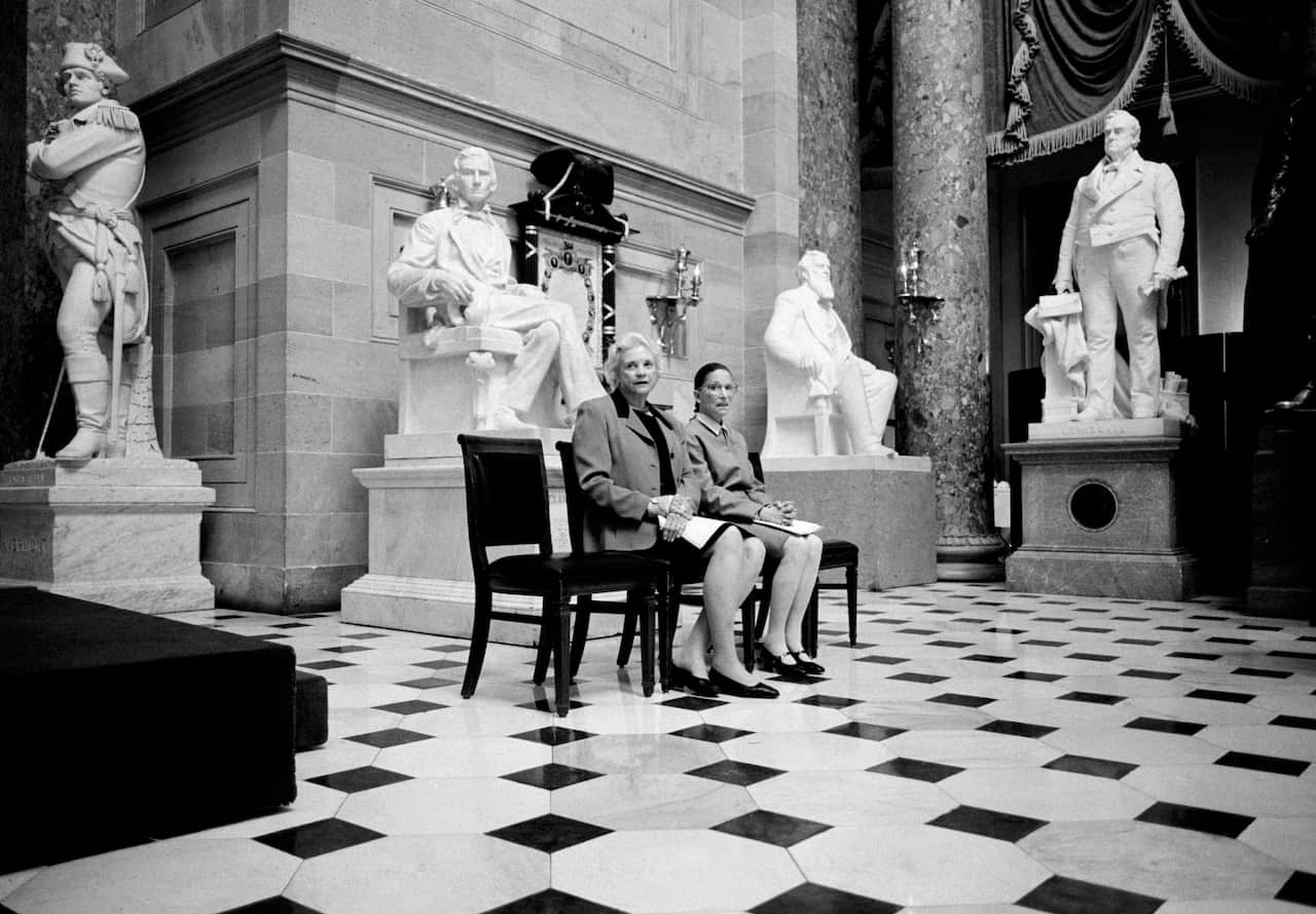 The only two female Justices of the US Supreme Court, Sandra Day O'Connor and Ruth Bader Ginsburg, pose for a portrait at the US Capitol Building in 2001.