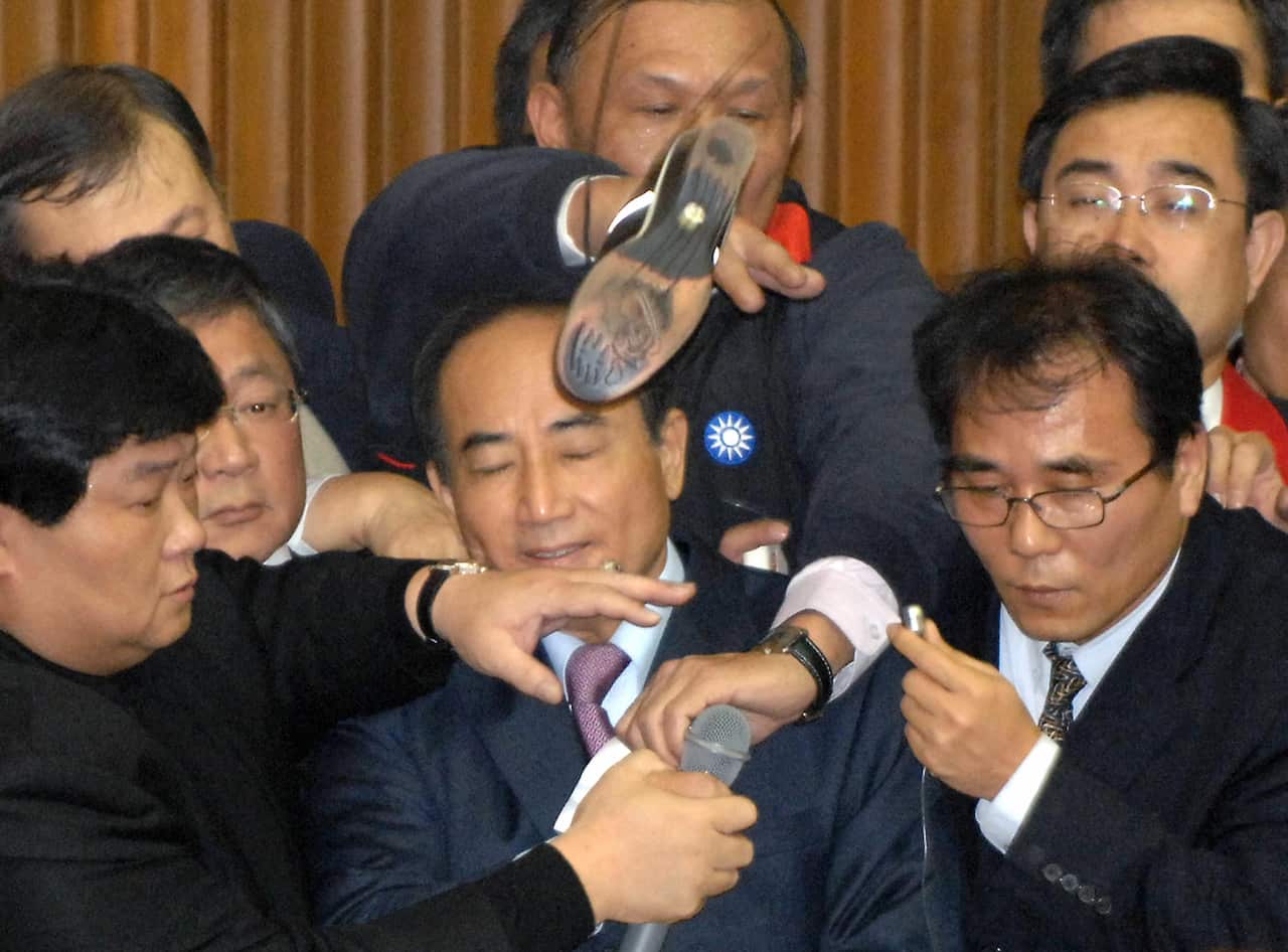 Wang Jin-pyng has shoe thrown at him