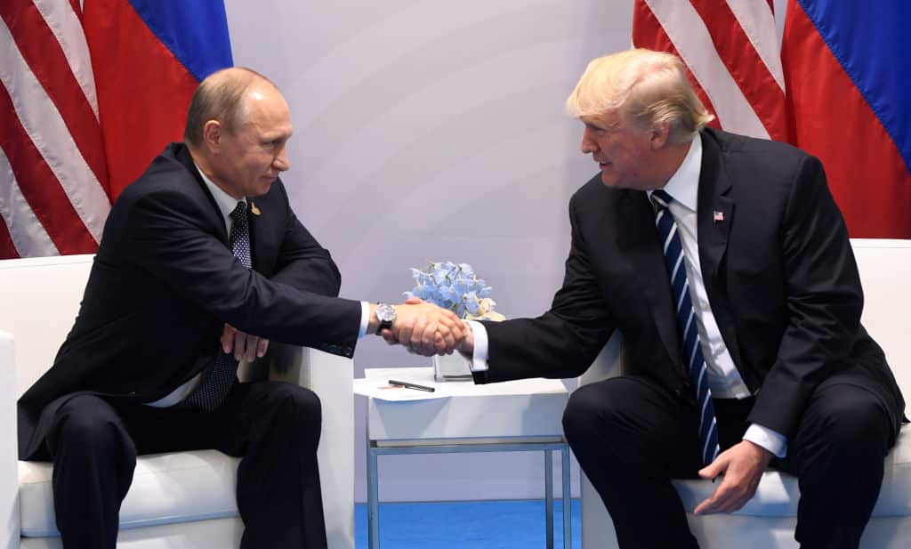 US President Donald Trump and Russia's President Vladimir Putin shake hands during a meeting on the sidelines of the G20 Summit in Hamburg, Germany, on July 7, 2017. / AFP PHOTO / SAUL LOEB        (Photo credit should read SAUL LOEB/AFP/Getty Images)