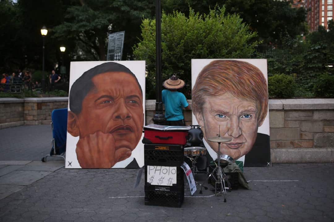 A painting of former US president Barack Obama, left, and current US president Donald Trump, right, is seen in New York City. 