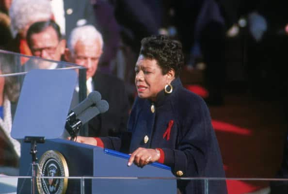 Maya Angelou stands at a lectern to recite her poem 'On the Pulse of Morning' at the inauguration of President Bill Clinton in Washington DC on 20 January, 1993. 