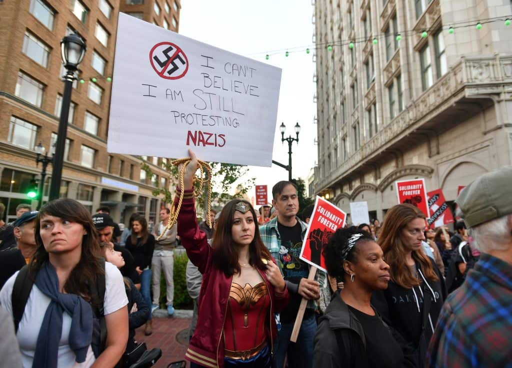 Protesters march in Oakland, California, on 12 August 2017 following the clashes in Charlottesville.