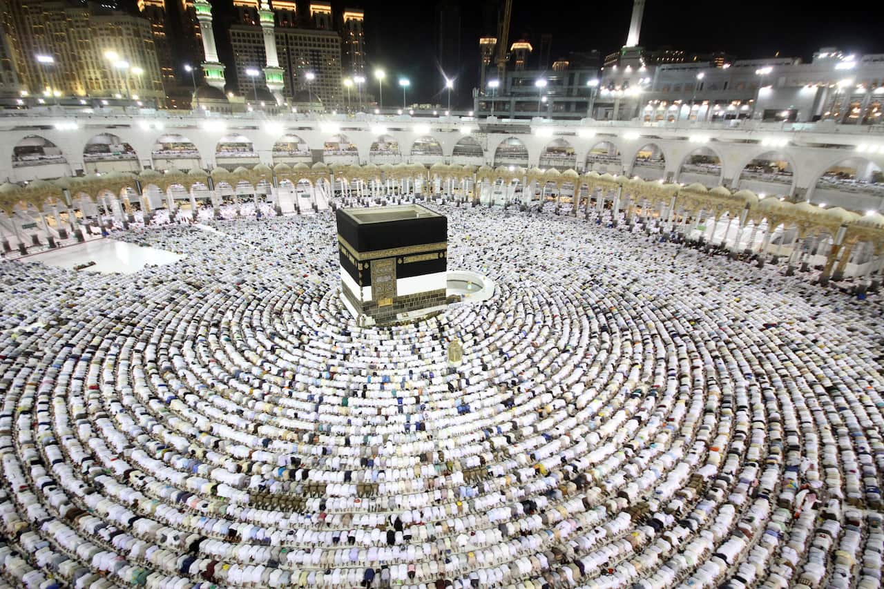 Muslim worshippers perform the eveningprayers at the Kaaba, Islam's holiest shrine, at the Grand Mosque in Saudi Arabia's holy city of Mecca in 2017.