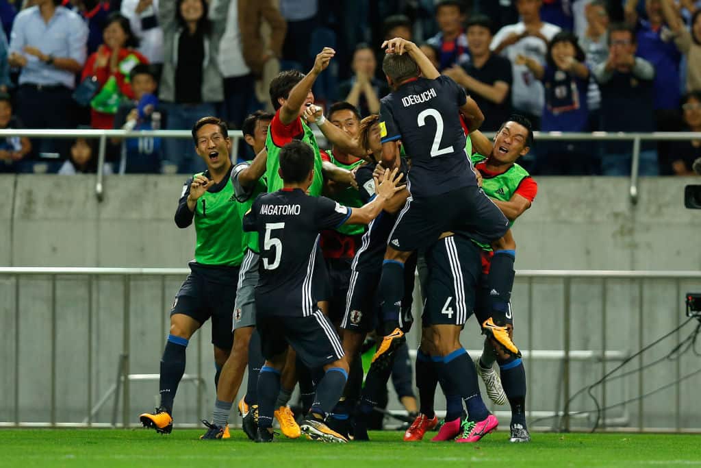 Japan celebrate scoring their second goal against Australia during the the FIFA World Cup Qualifier match
