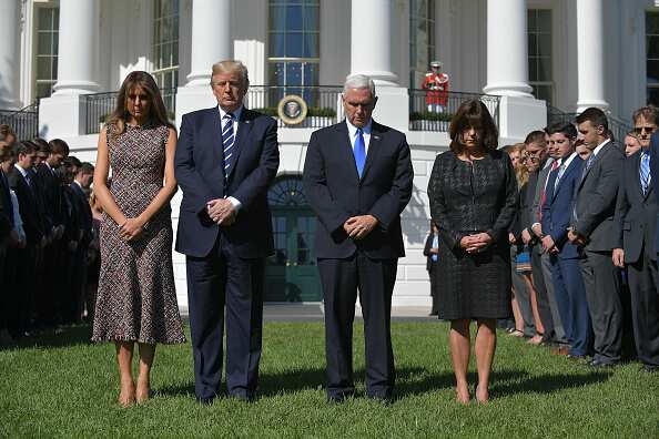 President Donald Trump, First Lady Melania Trump, Vice President Mike Pence, wife Karen Pence and White House staff take part in a moment of silence for the victims of the Las Vegas shootings, on the South Lawn of the White House on October 2, 2017.