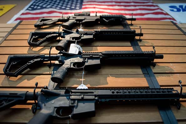 Assault rifles hang on the wall for sale at Blue Ridge Arsenal in Chantilly, Virginia, on October 6, 2017. / AFP PHOTO / JIM WATSON        (Photo credit should read JIM WATSON/AFP/Getty Images)