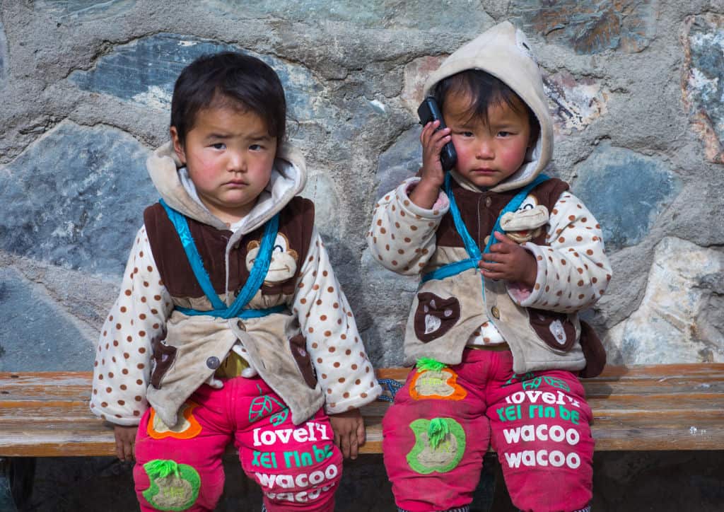 Tibetan language activists fear their language is not being passed on. Pictured: two Tibetan girls from the Gansu province.