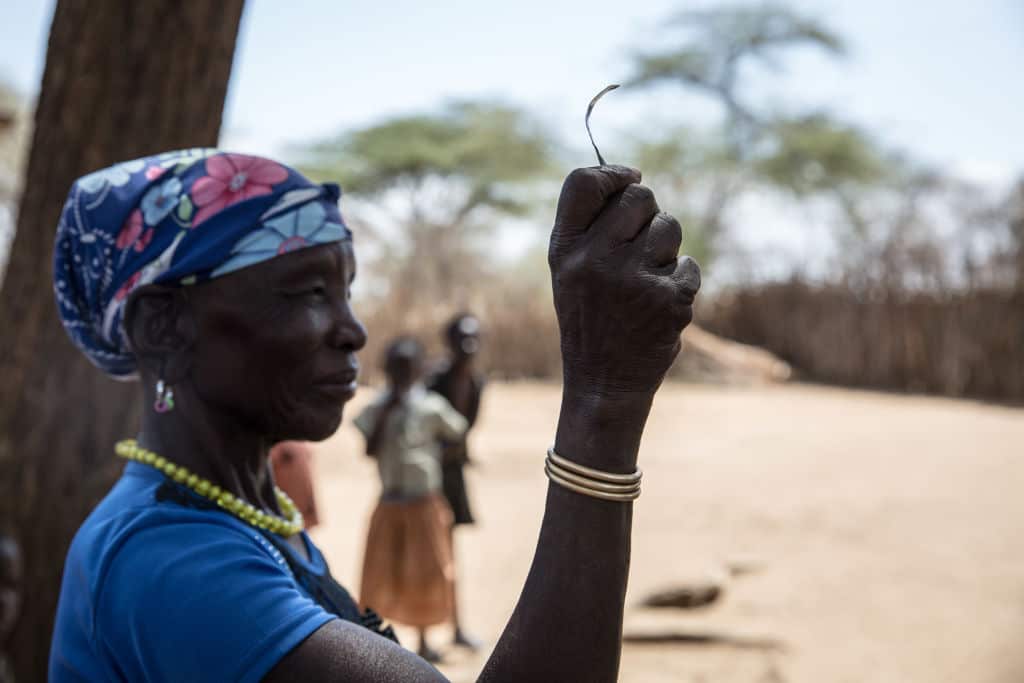 Monica Cheptilak claims she was the "chairperson of the knife cutters" in her tribe.