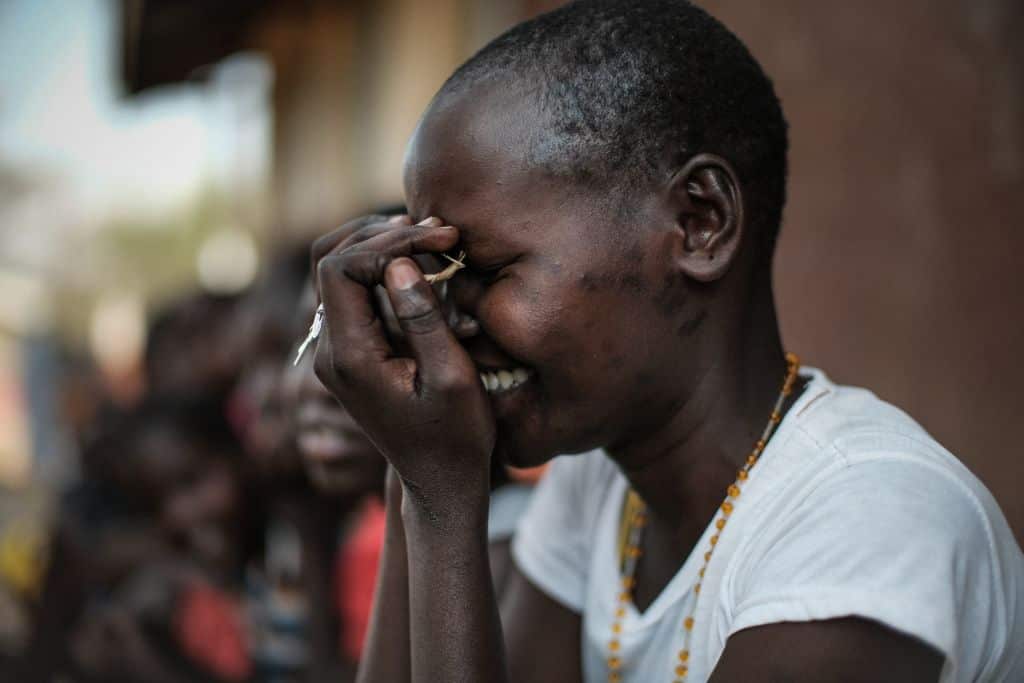A student of Kalas Girl's primary school, which hosts escaped girls from female genital mutilation (FGM) and child marriage, reacts in Amudat town, northeast Uganda, on January 31, 2018.