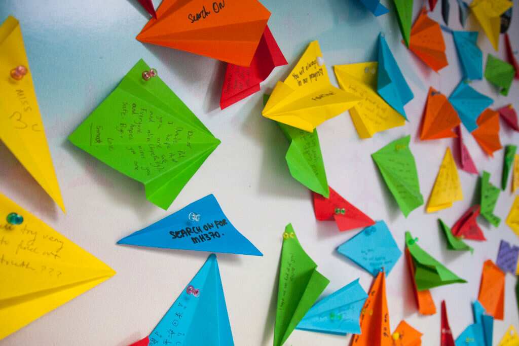 Paper planes hang on the wall at a Kuala Lumpur memorial event in March to commemorate the victims of MH370.