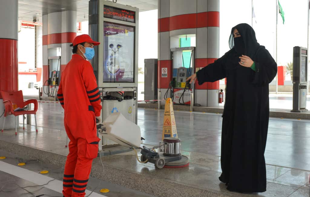 Saudi gas station supervisor Mervat Bukhari talking to a worker at her workplace in Khobar.