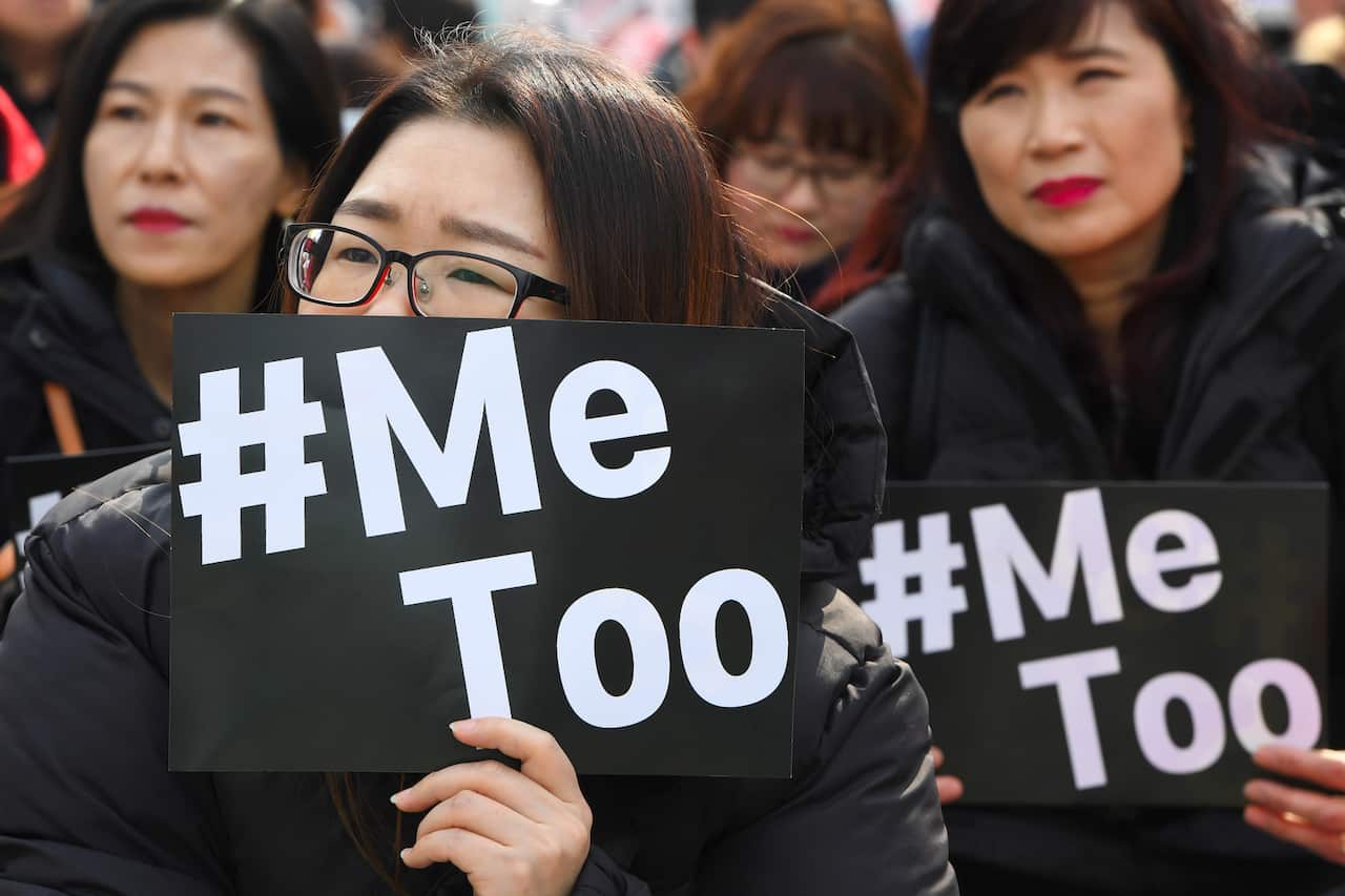 South Korean demonstrators hold banners during a rally to mark International Women's Day as part of the country's #MeToo movement in Seoul on March 8, 2018.