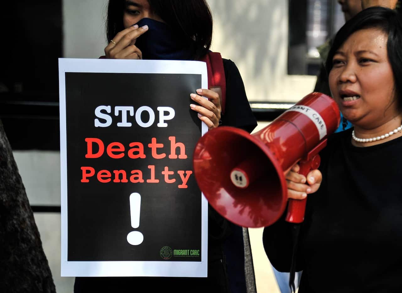 A protester delivers a speech to the Saudi government regarding the execution of an Indonesian migrant worker Zaini Misirin in 2018. 