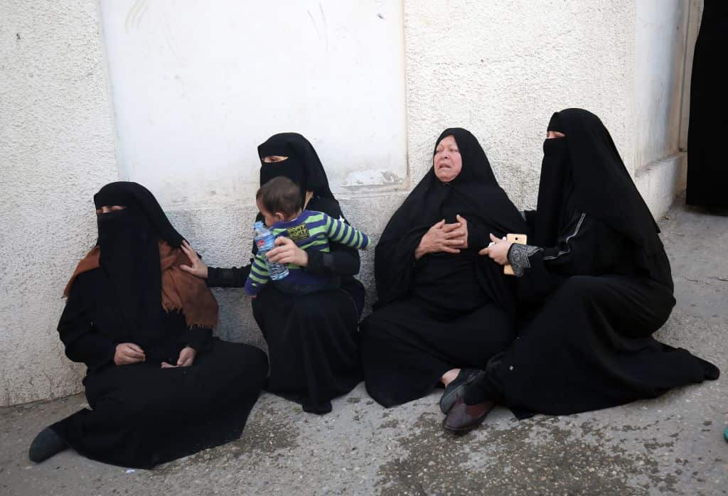 Palestinian relatives of a man who died in an explosion east of Rafah in the southern Gaza Strip, mourn at the Najjar hospital in Rafah on April 14, 2018.