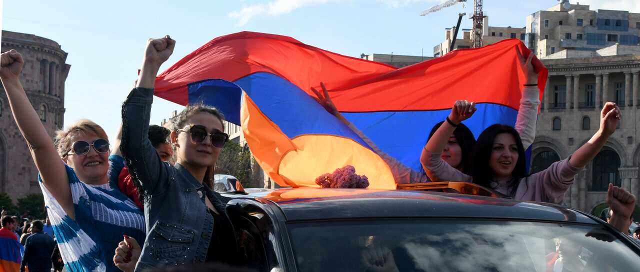 People celebrate in central Yerevan after Prime Minister Sargsyan announced his resignation. 