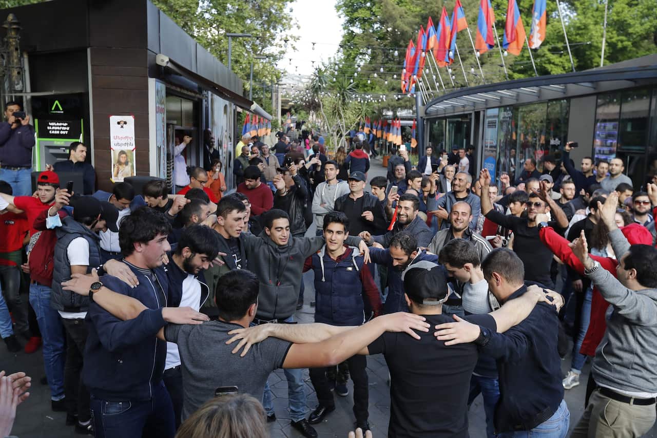 People celebrate in central Yerevan after Prime Minister Sargsyan announced his resignation. 