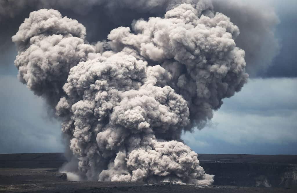 An ash plume rises from the Halemaumau crater within the Kilauea volcano summit caldera in 2018.