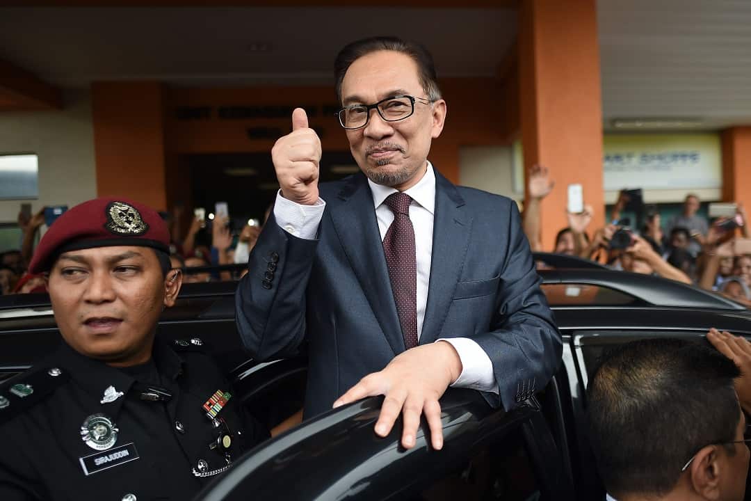 Anwar Ibrahim greets supporters after his release.