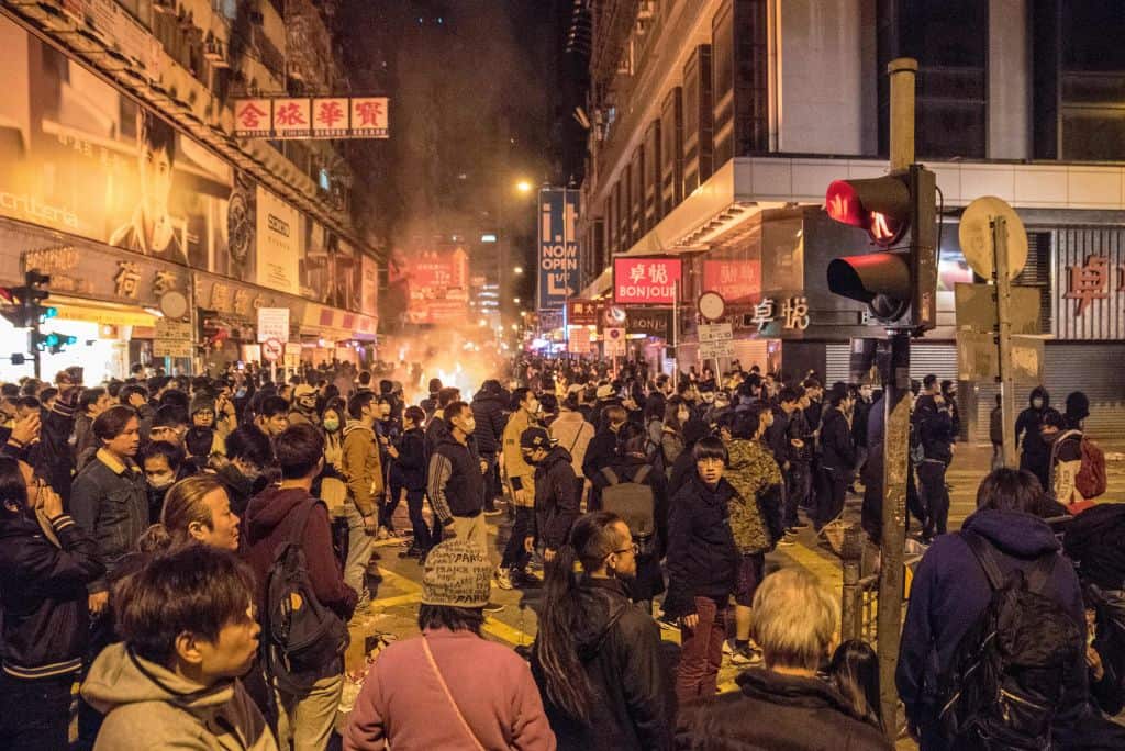 A fire started by protesters burns in the street during clashes with police in Hong Kong, later dubbed the "Fishball Revolution".