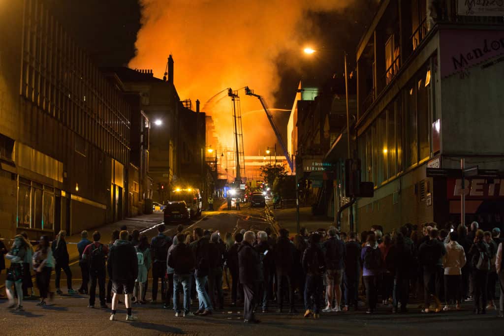 People gather in the Glasgow city centre as firefighters tackle the fire at the art school.