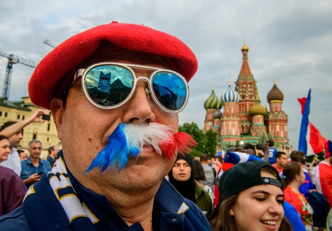 A France fan poses at the Red Square in Moscow.