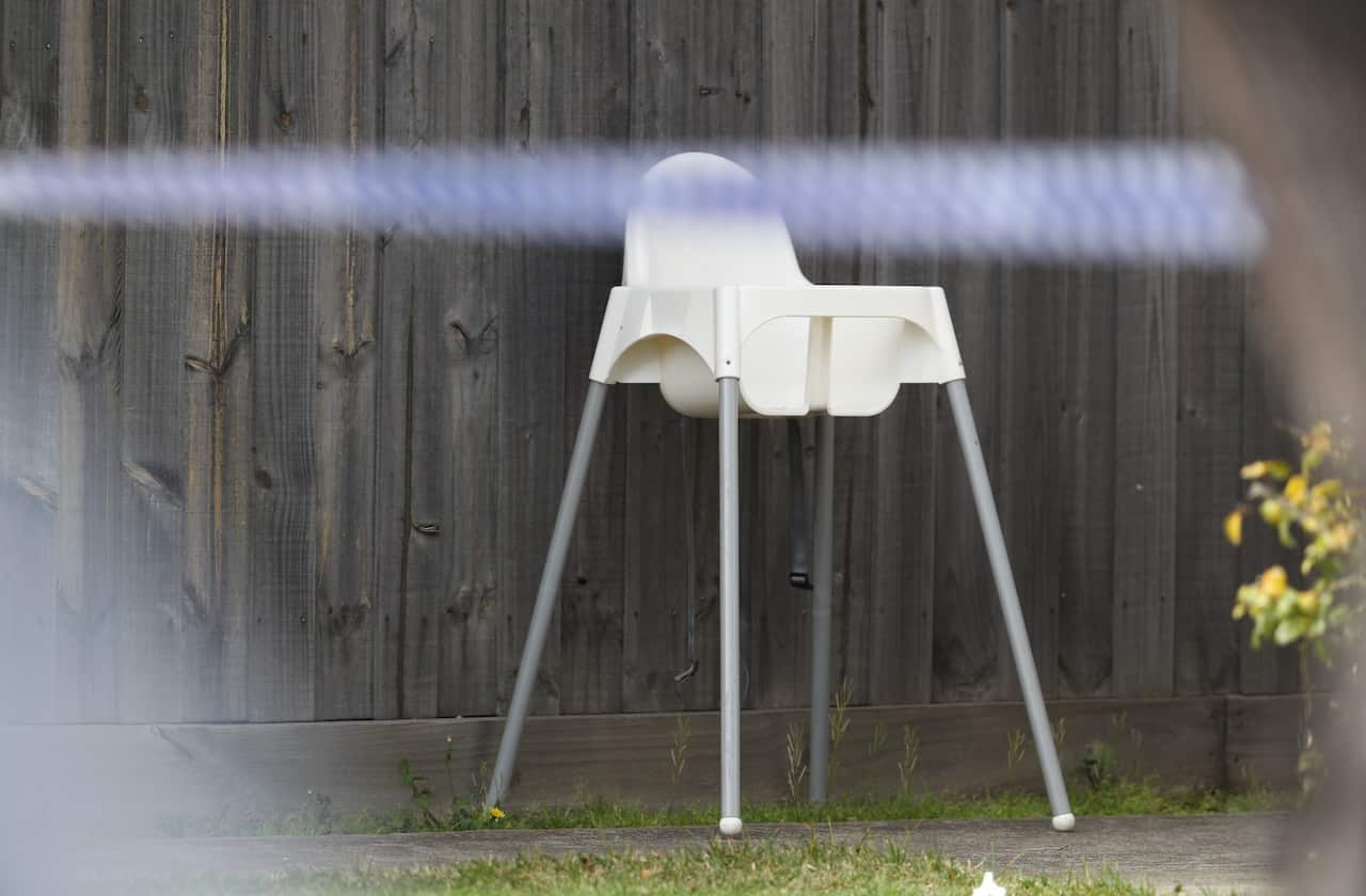 A highchair is seen in the front yard of a property involved in a house fire in Geelong, Melbourne, Thursday, September 13, 2018. 