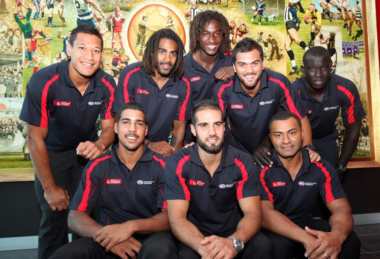 Wilkinson (below, left) with fellow AFL Multicultural Ambassadors in 2012. 