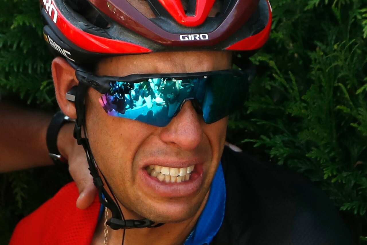 Australia's Richie Porte grimaces in pain after crashing during the ninth stage of the Tour de France cycling race