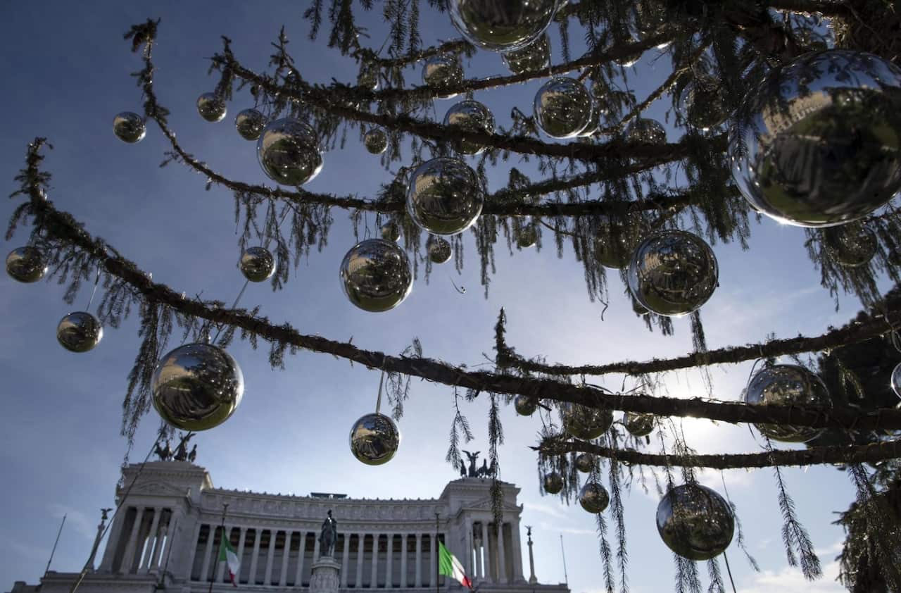 Despite the tree's 600 silver-colored decorative balls, the half-bare branches lend the square a forlorn rather than festive look 