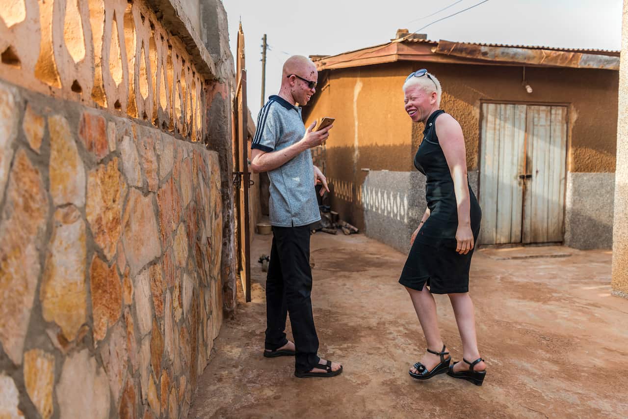 Kwame Andrews Daklo and Bernice Agboada laugh together in Ashaiman, Ghana.