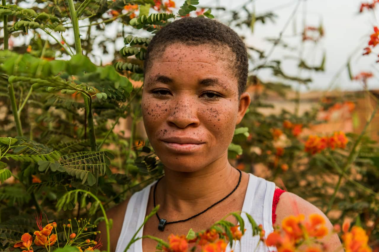 Beatrice Adjei, a college student in her last year of school, outside a friend's home in Ashaiman, Ghana.
